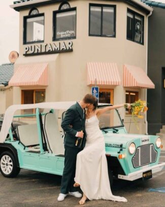 Puntamar-Wedding-image a couple kissing next to a car